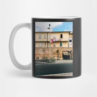 Yellow Residential Building in Italy With Drying Laundry on Washing Line Mug